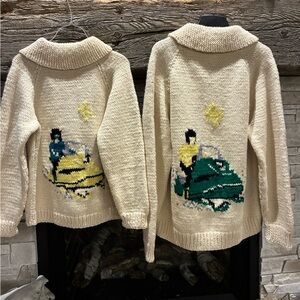 Vintage Cowichen wool Cream snowmobile Sweaters with sled designs.